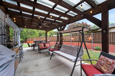 View of patio featuring a pergola and ceiling fan