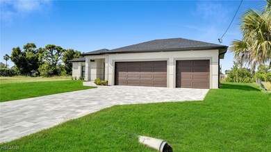 Garage featuring decorative driveway