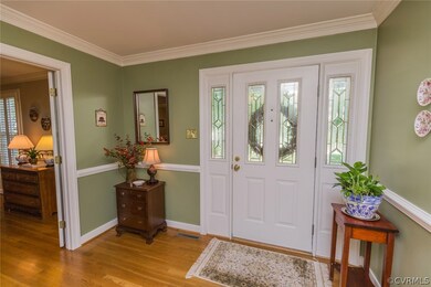 The front entrance hall receives lots of natural l