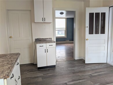 Kitchen view to dining room, basement access and r