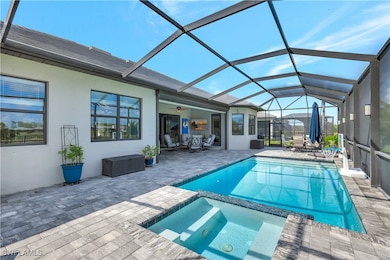 View of pool with a patio, a pool with connected h