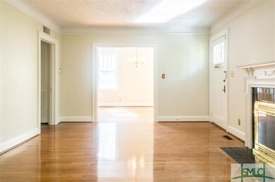 Living room with fireplace looking towards dining 