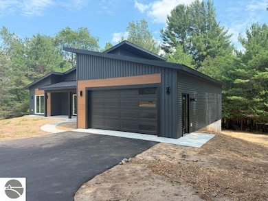 9890 Cushman Ct unit 4, Williamsburg, MI 49690 - photo 2