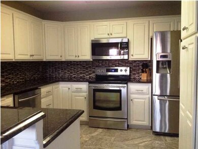 Main kitchen just off the garage makes it easy to 