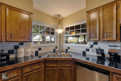 Kitchen featuring tasteful backsplash, plenty of n