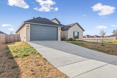 Ranch-style house featuring brick siding, concret