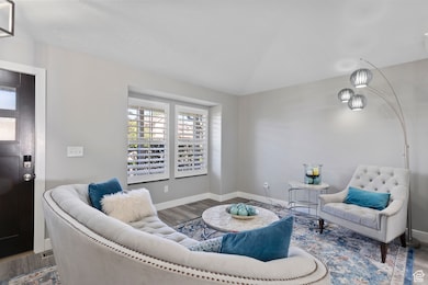 Living area featuring wood finished floors and baseboards
