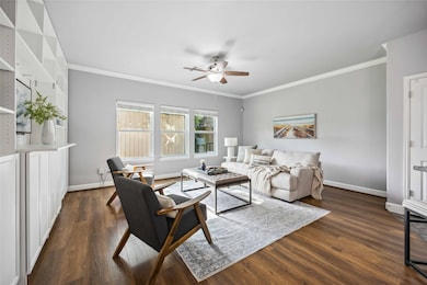 The living room features a high ceiling trimmed in