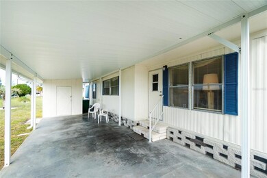 Car port and patio area.