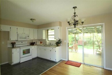Lovely kitchen with newly tiled floors and walk ou