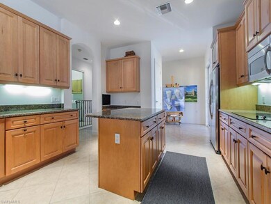 Kitchen with nook leading to balcony