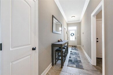 Long foyer provides privacy from the street. Bedro