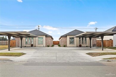 View of front of property with a carport