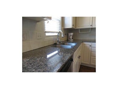 Beautiful granite counters & tile backsplash