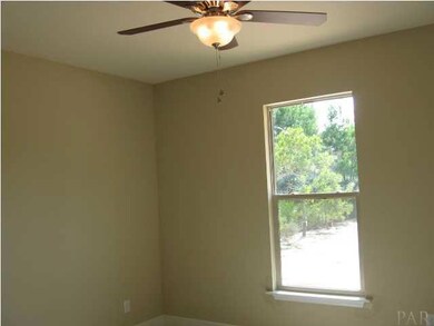 spacious guest bedrooms with windows overlooking rear yard or forested area in front