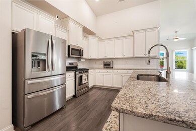 Kitchen featuring backsplash, dark hardwood / wood