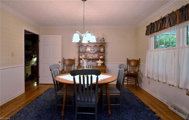 Dining room featuring hardwood flooring and orname