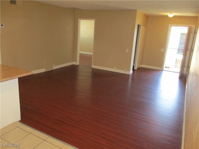 Unfurnished living room with light wood-style floo