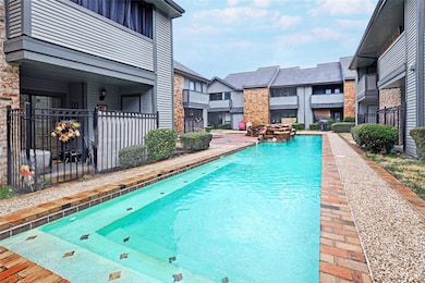 View of swimming pool featuring fence, a fenced in