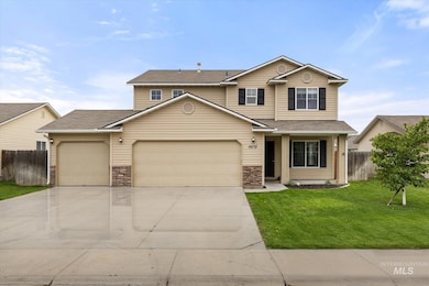 Traditional-style home with stone siding, concrete driveway, an attached garage, and a shingled roof