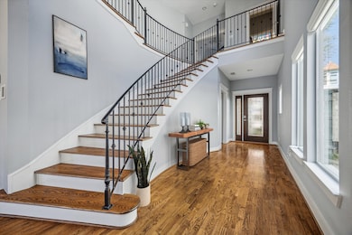 Gorgeous entry w/a stunning wrought-iron staircase