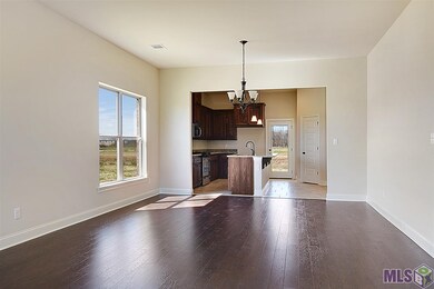 Open living, dining and kitchen.