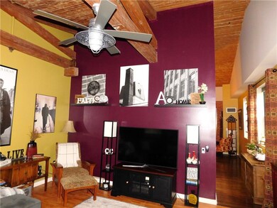 More living room, more brick and beams
