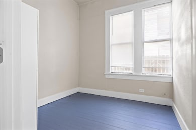 Empty room featuring baseboards and hardwood / wo