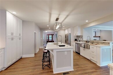 Pantry cupboards to left. Also a desk area and mor