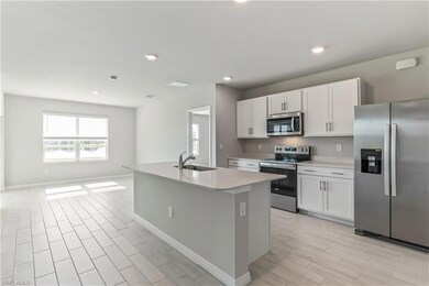 10321 Blooming Blossom Ct, Tice, FL 33905 - photo 7