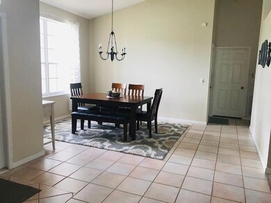 Formal dining room, all fully tiled.