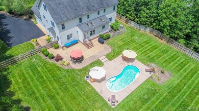 Gorgeous photo of the large irrigated well- tended fenced rear yard, the salt water pool, and patios!