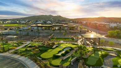 View of property's community featuring a residential view, a mountain view, and a putting area