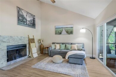 Living room featuring ceiling fan, light hardwood 