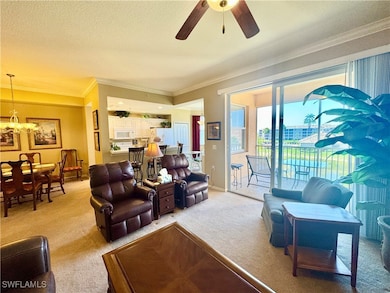 Living room with baseboards, ornamental molding, a
