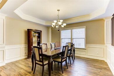 Formal Dining Room with Wide Plank Wood Flooring, 