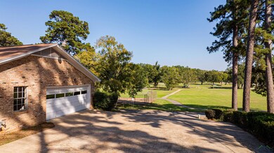 View of side of property with a yard
