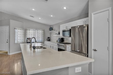 Kitchen with premium appliances, a sink, visible v