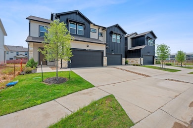 View of front of home with a front lawn, stone si