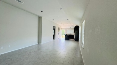 Empty room featuring baseboards and recessed ligh