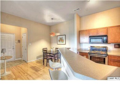 The eating bar perfectly defines the kitchen while