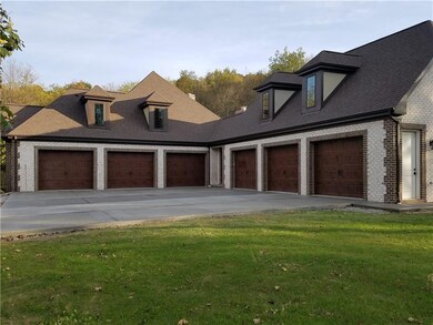 6 Car Attached Garage with large concrete turning 