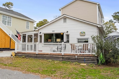 Back of property featuring a sunroom
