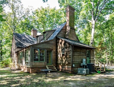 Rear view of house with central AC unit