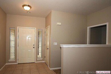Very nice tiled entry and a handy coat closet to t