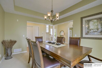 To your left as you walk in is the formal Dining Room with hardwood floors.