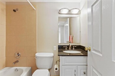 Full bathroom featuring tiled shower / bath, vanit