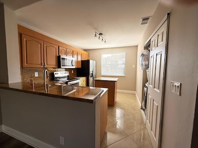 5781 Riverside Dr unit 201A4, Coral Springs, FL 33067 - photo 3