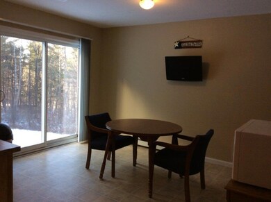 DINING AREA / SLIDING DOORS TO BACK...