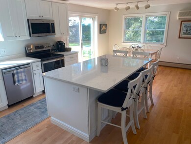 Kitchen view to Dining area and rear deck